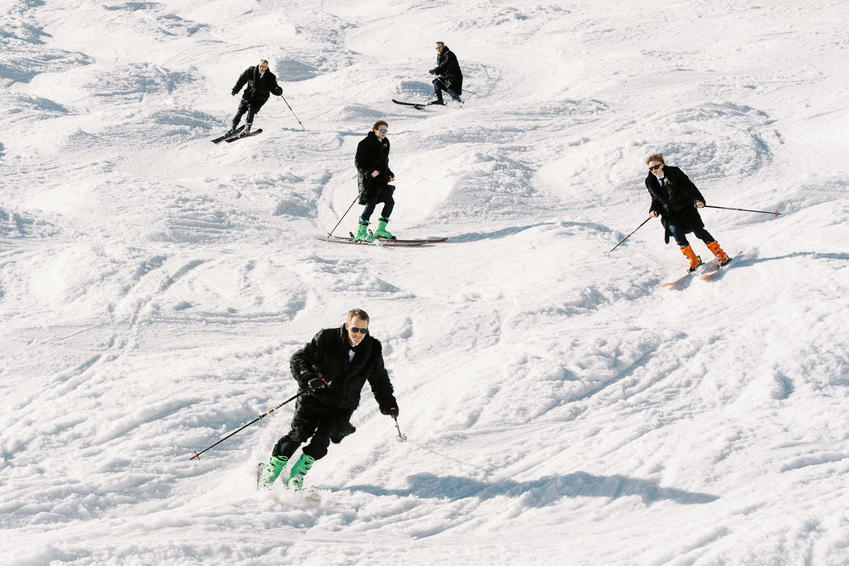 the bestmen and the groom skiing captured by St Moritz wedding photographer Sylvain Bouzat