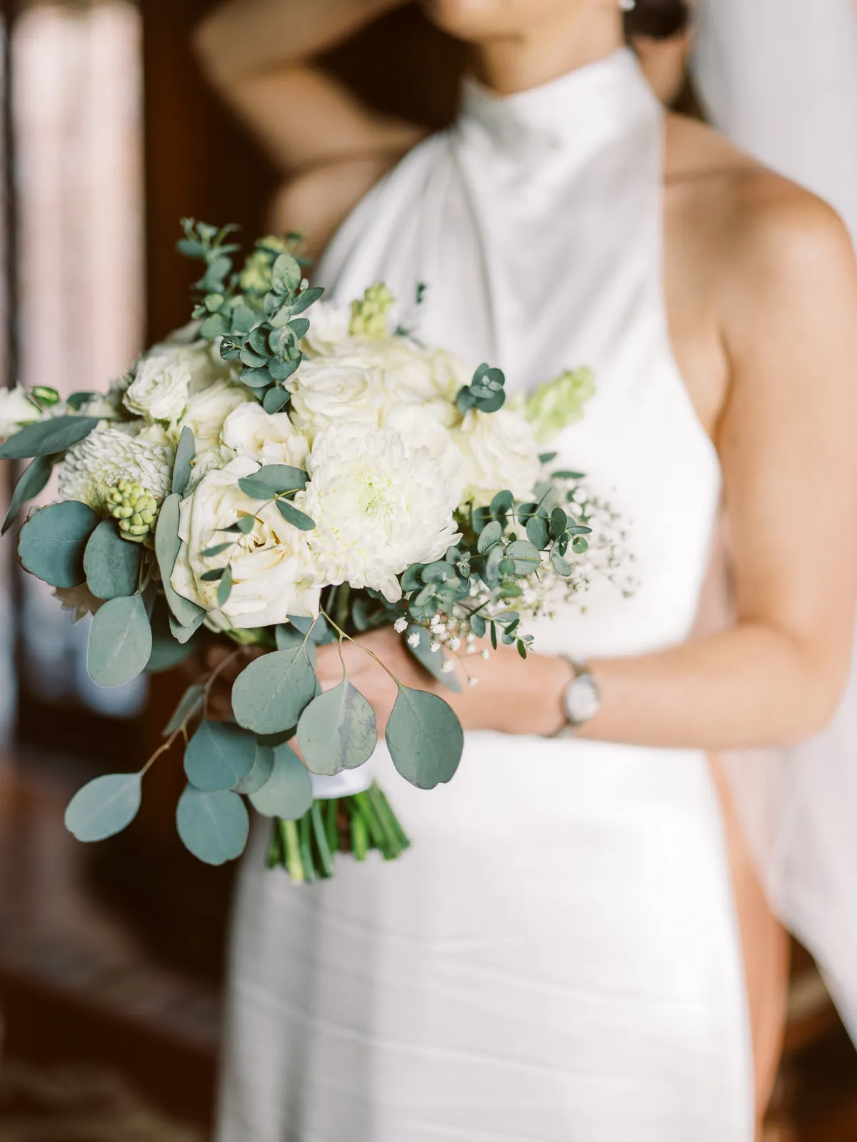 Close-up of bride holding a beautiful white and green bouquet in Lombok - photo by wedding photographer Lombok.