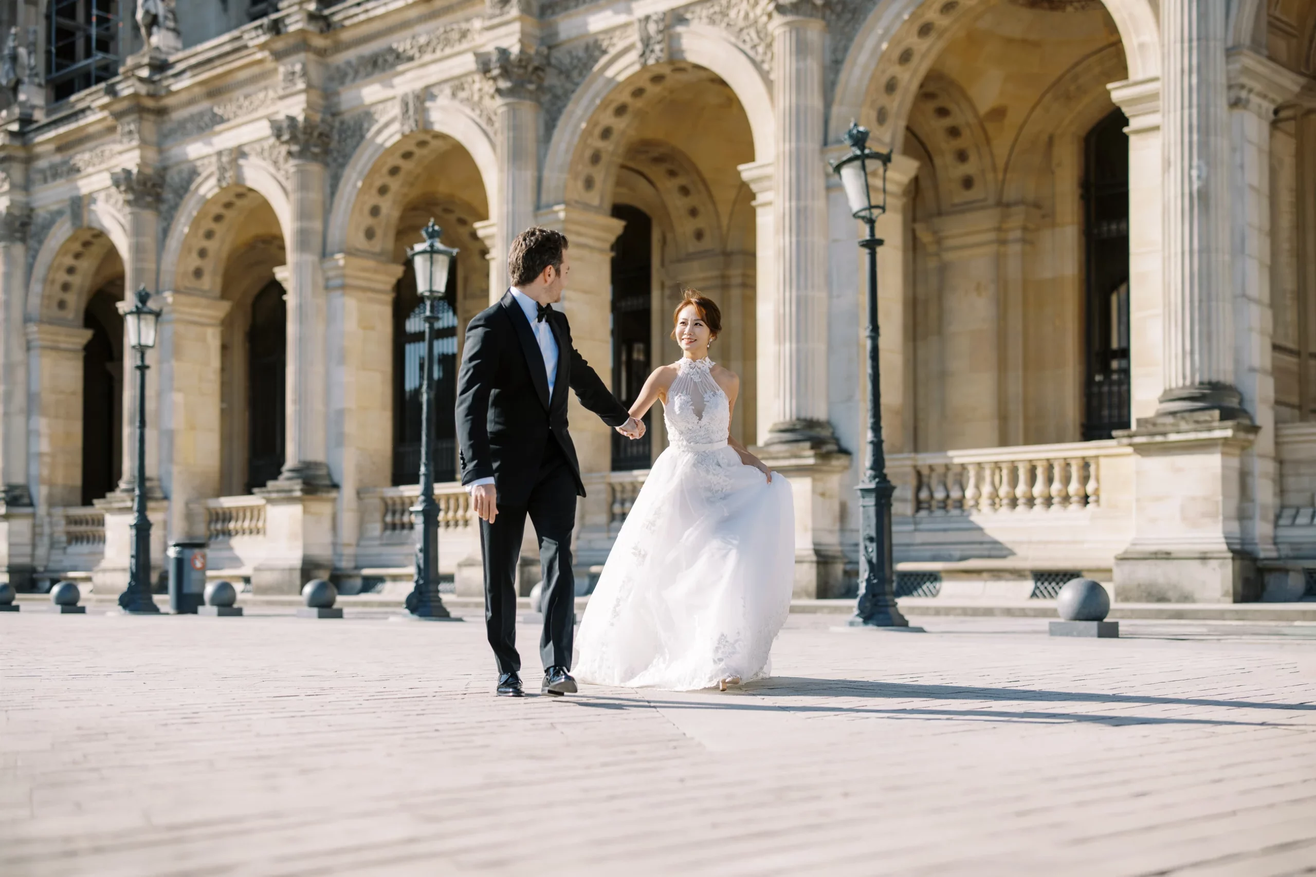 A stunning view of the Eiffel Tower and Parisian rooftops, an iconic backdrop for a Paris couple photo session. The quintessential Parisian view is the perfect start to any love story in the city. When couples ask, "How much does a photographer in Paris cost?" part of the answer lies in gaining access to and knowledge of these incredible, hard-to-find viewpoints. An experienced Paris wedding photographer knows the best locations to capture the Eiffel Tower without the crowds, making the investment worthwhile for an unforgettable Paris couple photo session. How much does a photographer in Paris cost?