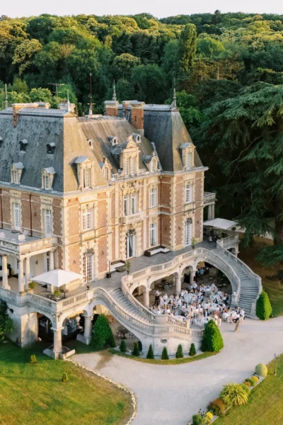 Aerial view of a luxury chateau, Chateau de Bouffemont, reception by a french wedding photographer.