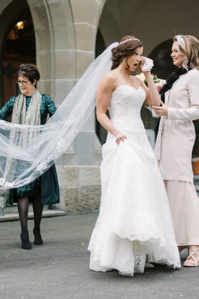Emotional bride arriving at her ceremony captured by a French wedding photographer.