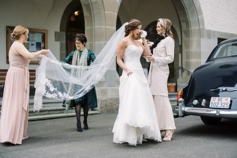 Emotional bride arriving at her ceremony captured by a French wedding photographer.
