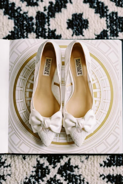 Badgley Mischka lace bridal shoes captured by a professional French wedding photographer during morning preparations.