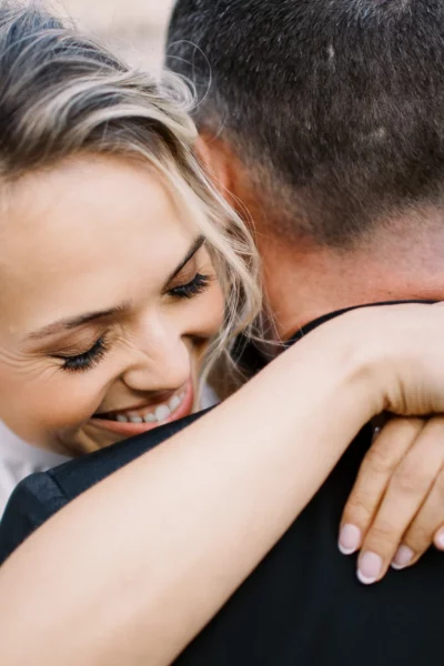 A joyful bride embracing her groom during a luxury session with the Best European wedding photographer.