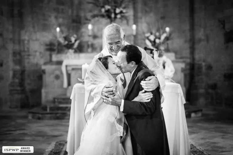 32-awards-wedding-photographer-priest-kiss-church-ceremony