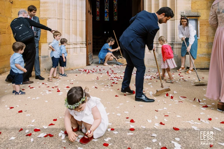 33-awards-wedding-photographer-cleanup-flower-petals-church