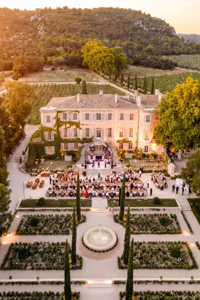 Aerial view of a luxury chateau wedding reception in Provence at Chateau d'Estoublon by a French wedding photographer.