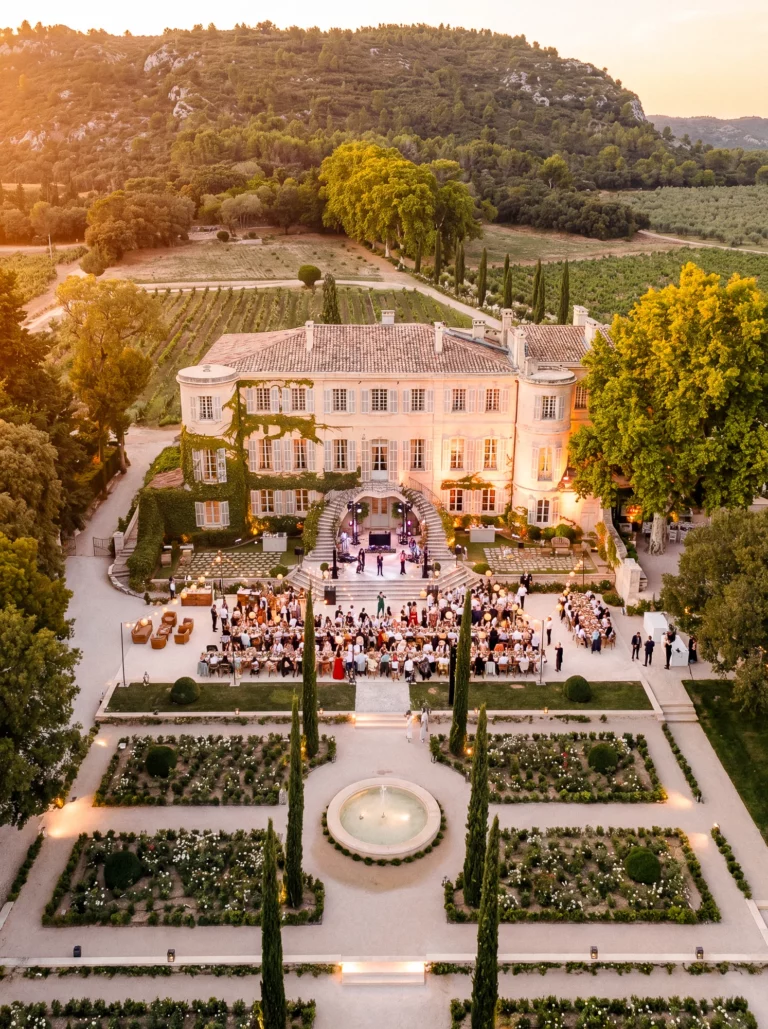 Aerial view of a luxury chateau wedding reception in Provence at Chateau d'Estoublon by a French wedding photographer.