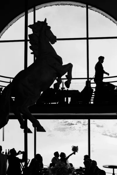 Silhouette of a couple kissing in an Alps La Folie Douce by a French wedding photographer.