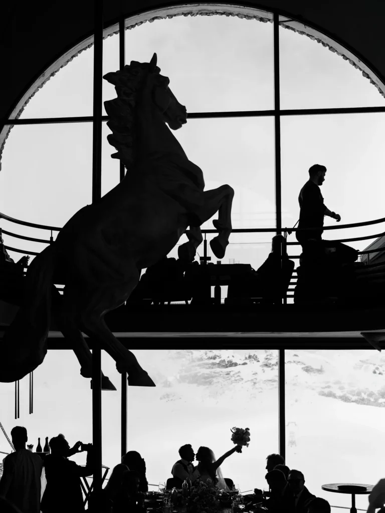 Silhouette of a couple kissing in an Alps La Folie Douce by a French wedding photographer.