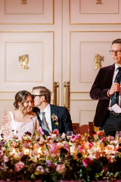 Emotional dinner speeches captured by a french wedding photographer in a luxury ballroom setting.