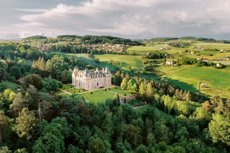 Aerial view of a historic luxury estate Domaine des Halles captured by a professional French wedding photographer.