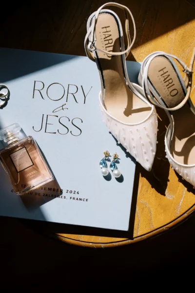 Luxury bridal accessories flat lay captured by a French wedding photographer at Chateau de Jalesnes.