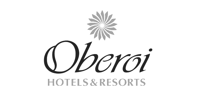 Oberoi Hotels & Resorts logo, a prestigious venue for the best french wedding photographer.